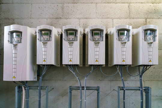 Variable speed drives mounted to a wall