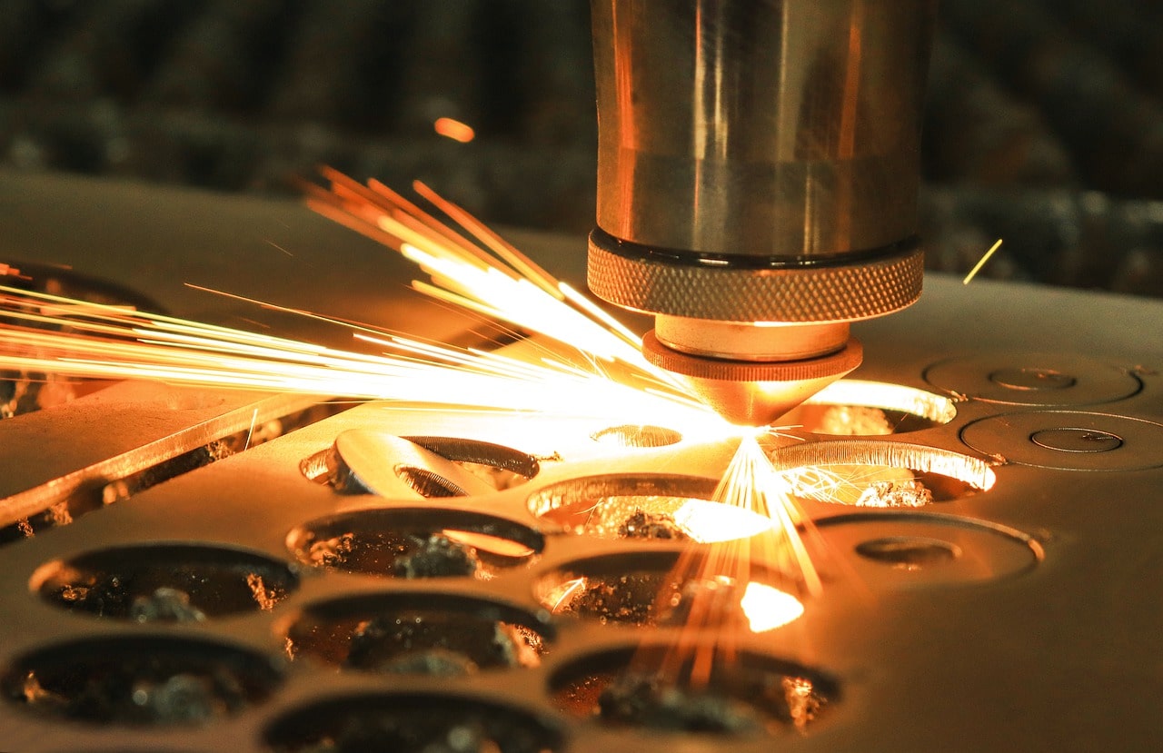 Laser cutting machine cutting round shapes out of a metal sheet